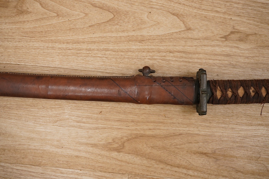 A Japanese WWII Shin gunto (sword) and leather mounted scabbard